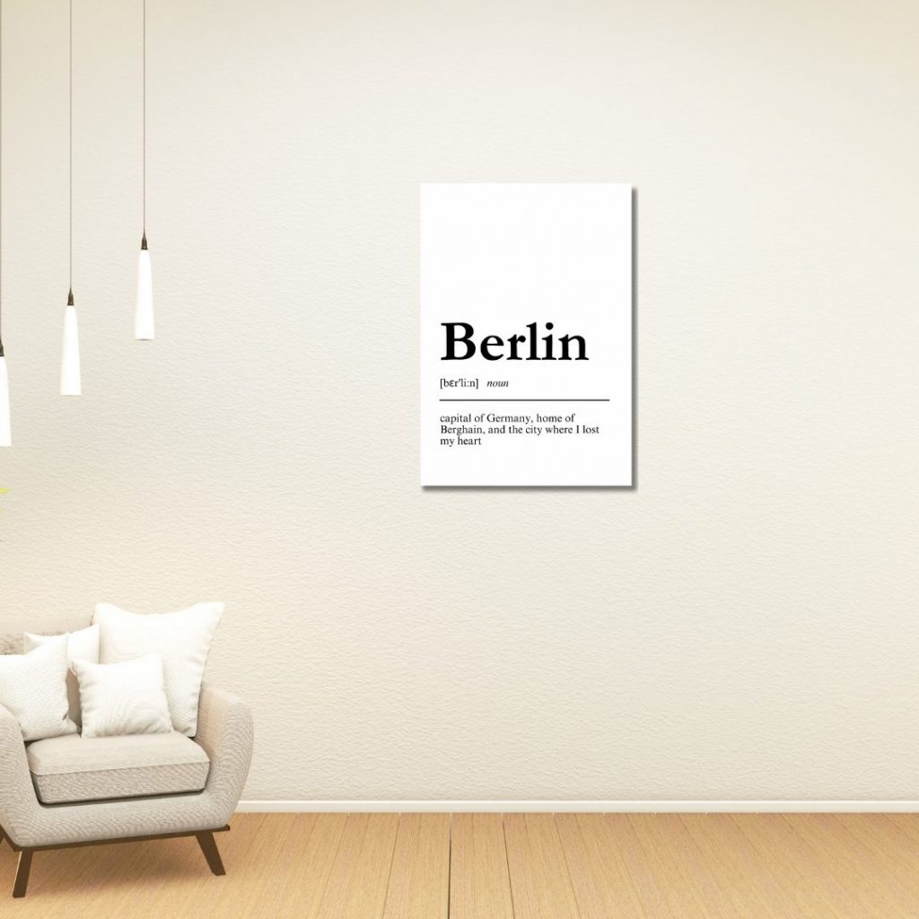 a wall with a poster of a definition of berlin