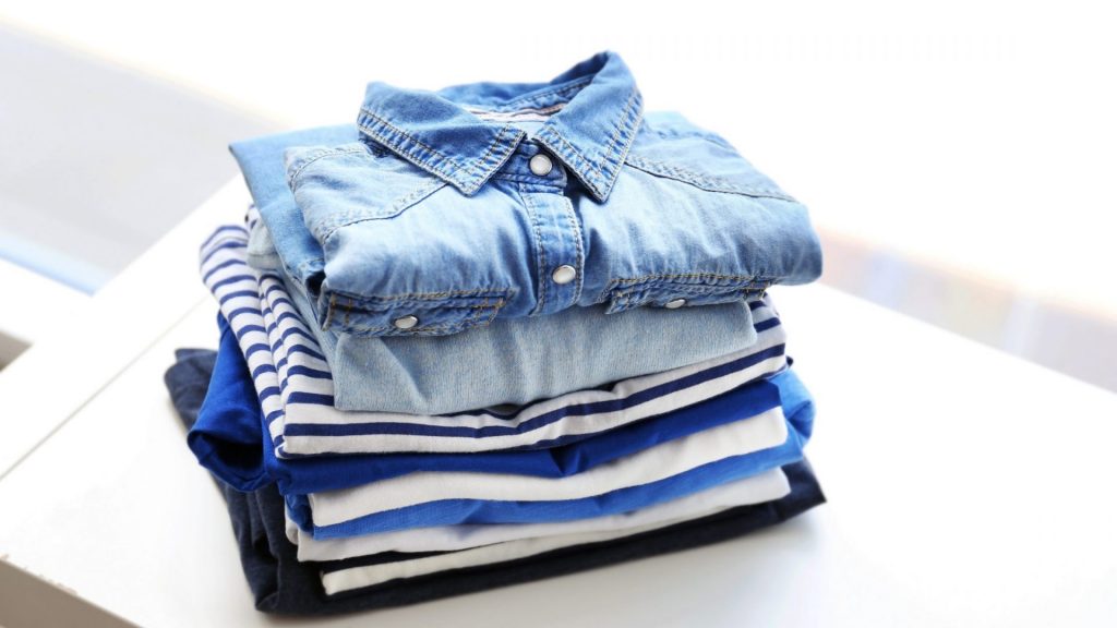 stack of clothes for selling on vinted
